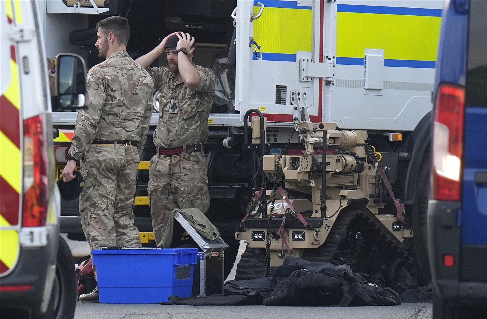 Members of the armed services at the scene (Danny Lawson/PA)