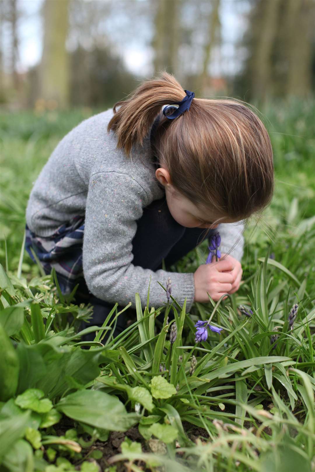 Princess Charlotte smelling a bluebell at their home in Norfolk (Duchess of Cambridge/PA)