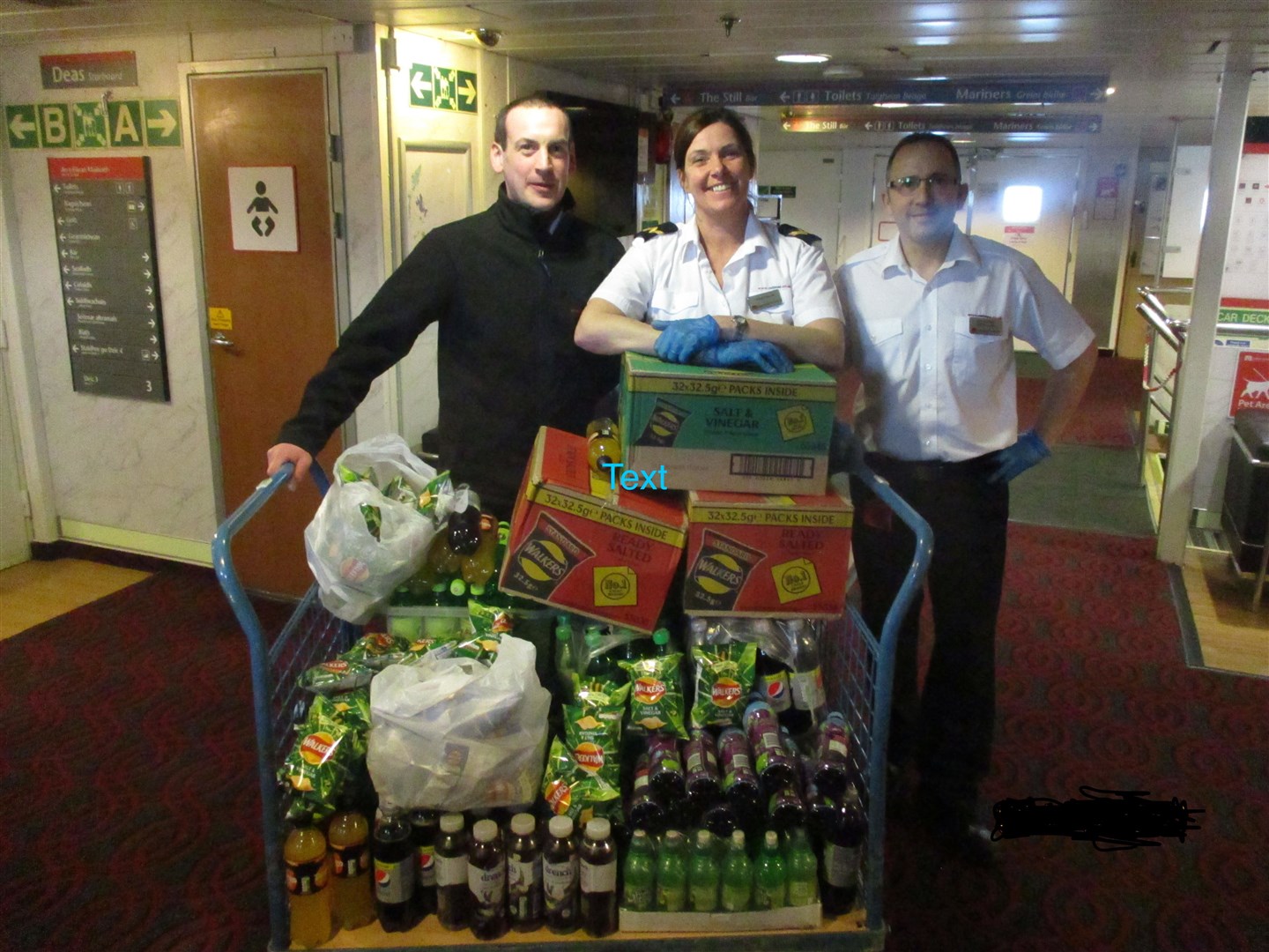CalMac crew members (left to right) Ian MacLennan, Donna Maxwell and Keith MacMillan from the MV Isle of Mull prepare a fiid shipment for distribution.