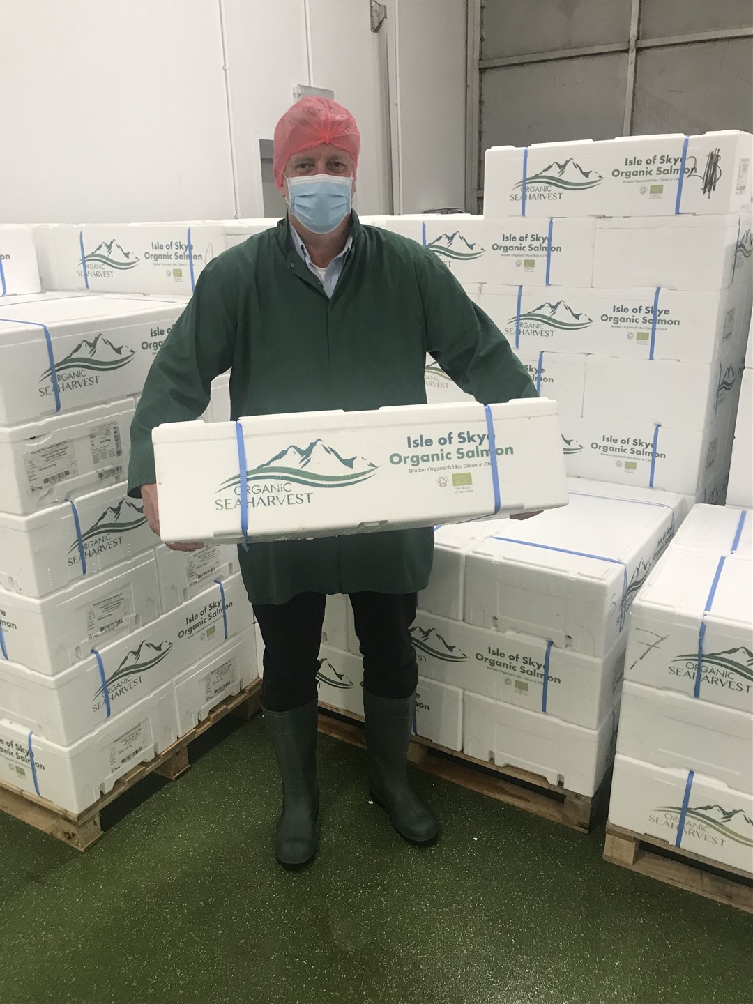 Robert Gray holding one of the very first boxes of Organic Sea Harvest salmon at Loch Duart in Dingwall.