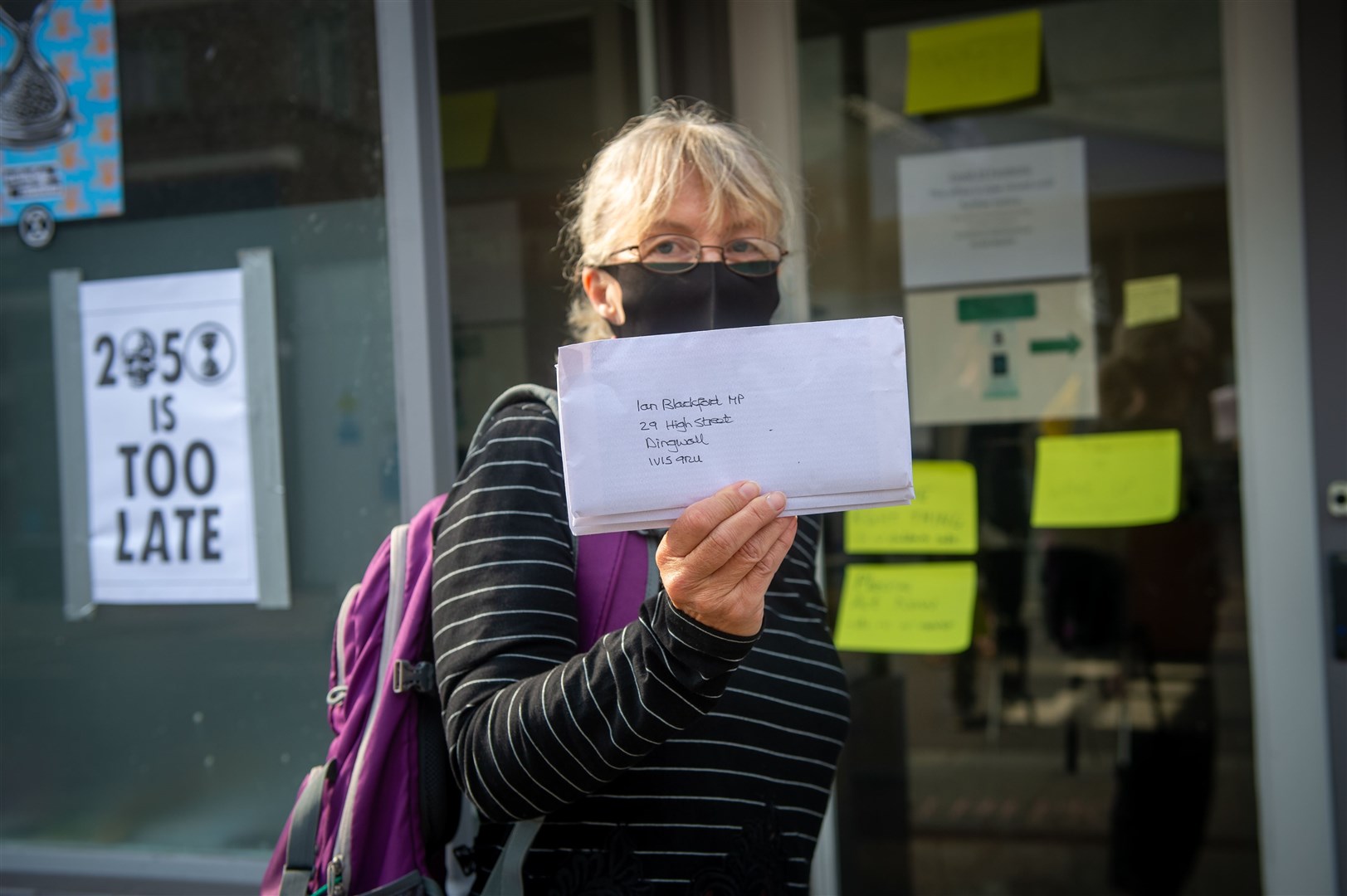 At the Extinction Rebellion protest in the High Street, Dingwall, Kate McLachlan with a letter for Ian Blackford MP calling for support. Picture: Callum Mackay