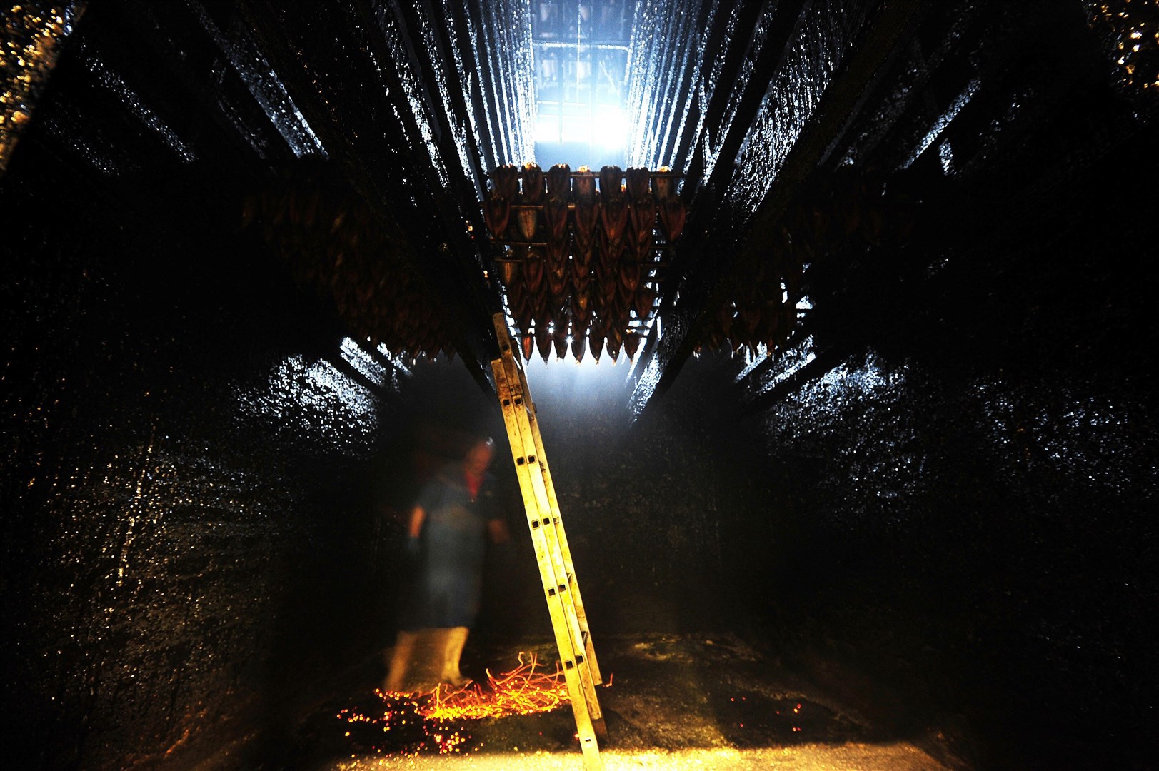 The business still uses traditional techniques to smoke the fish (Owen Humphreys/PA)