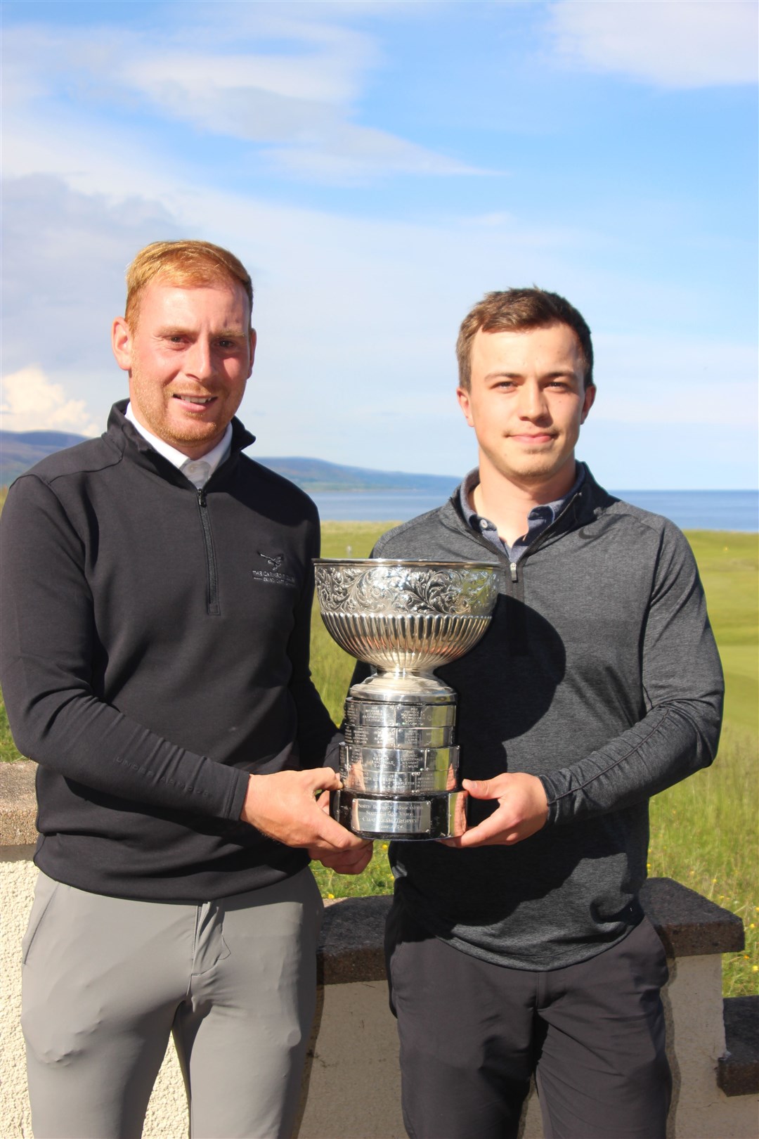The Royal Dornoch duo with the team trophy Liam MacDonald-MacLeod (left) and North District individual winner Michael Schinkel (right).