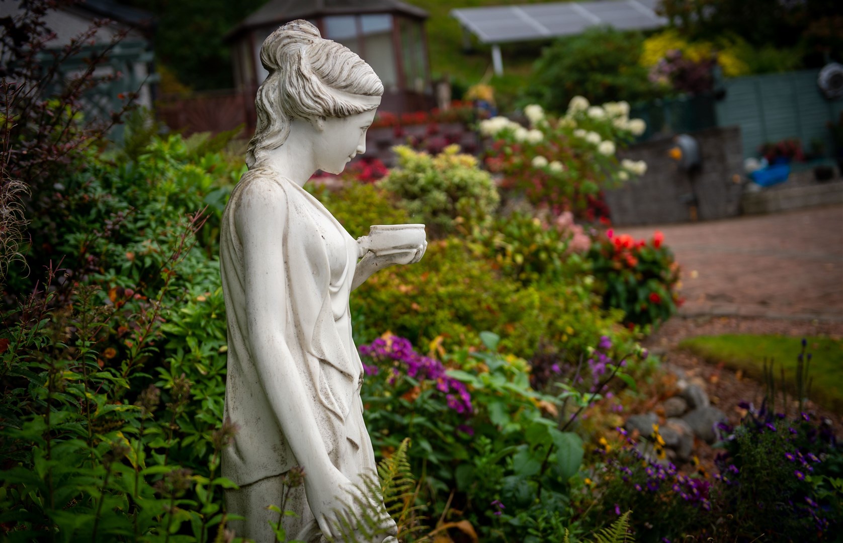 Mr and Mrs Fraser want a companion for their current garden statue. Pictures: Callum Mackay