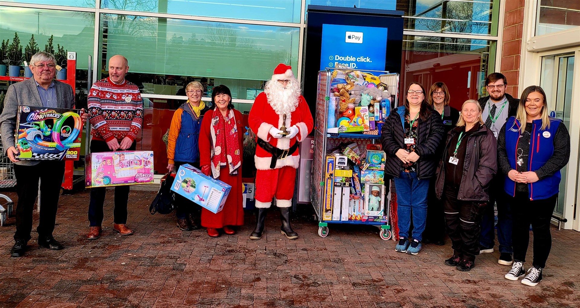 Councillors, Santa, and Dingwall Tesco with gift donations to Ross-shire children.
