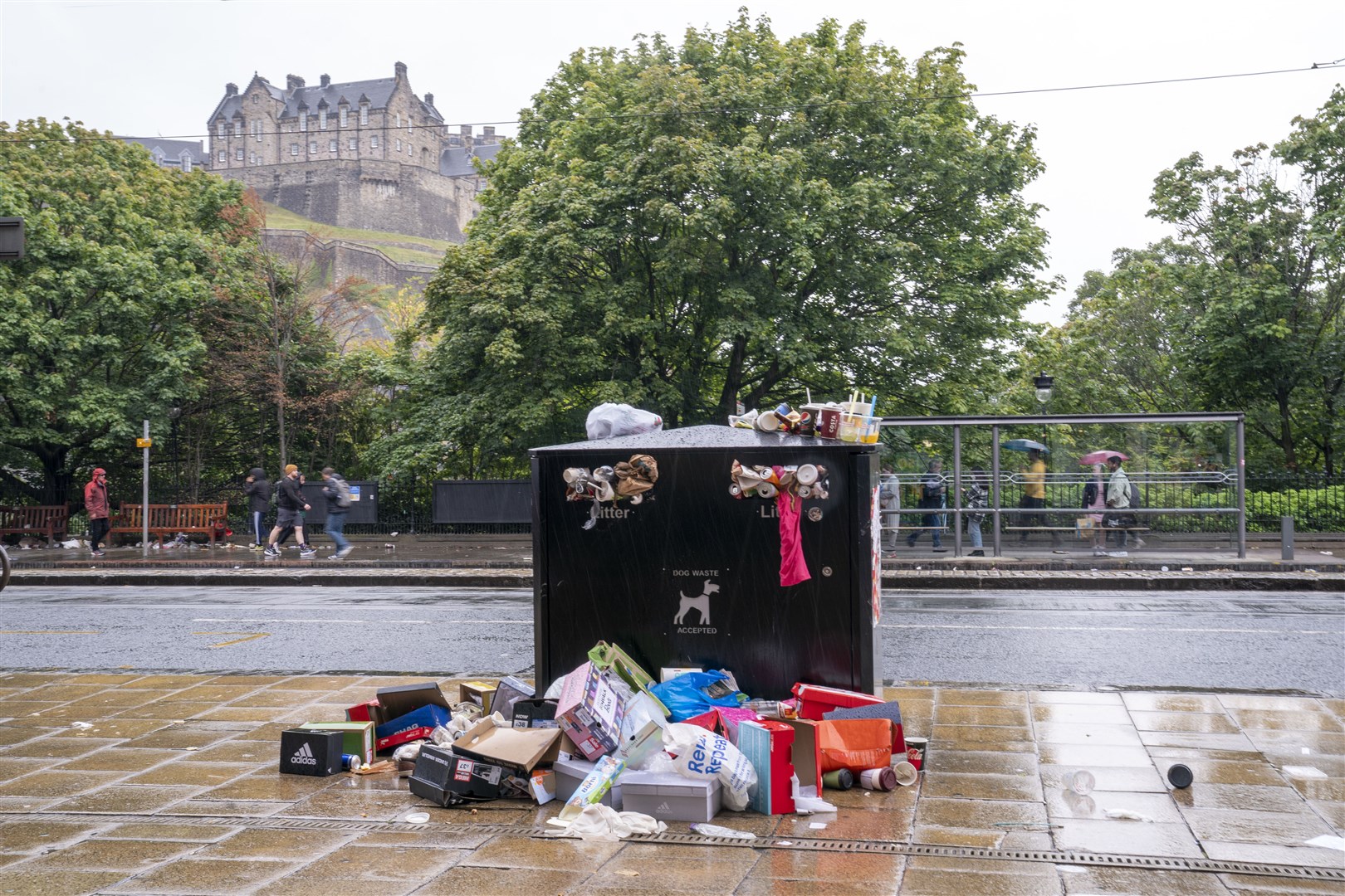 Bins overflowing with litter along Princes Street in Edinburgh city centre (Jane Barlow/PA)