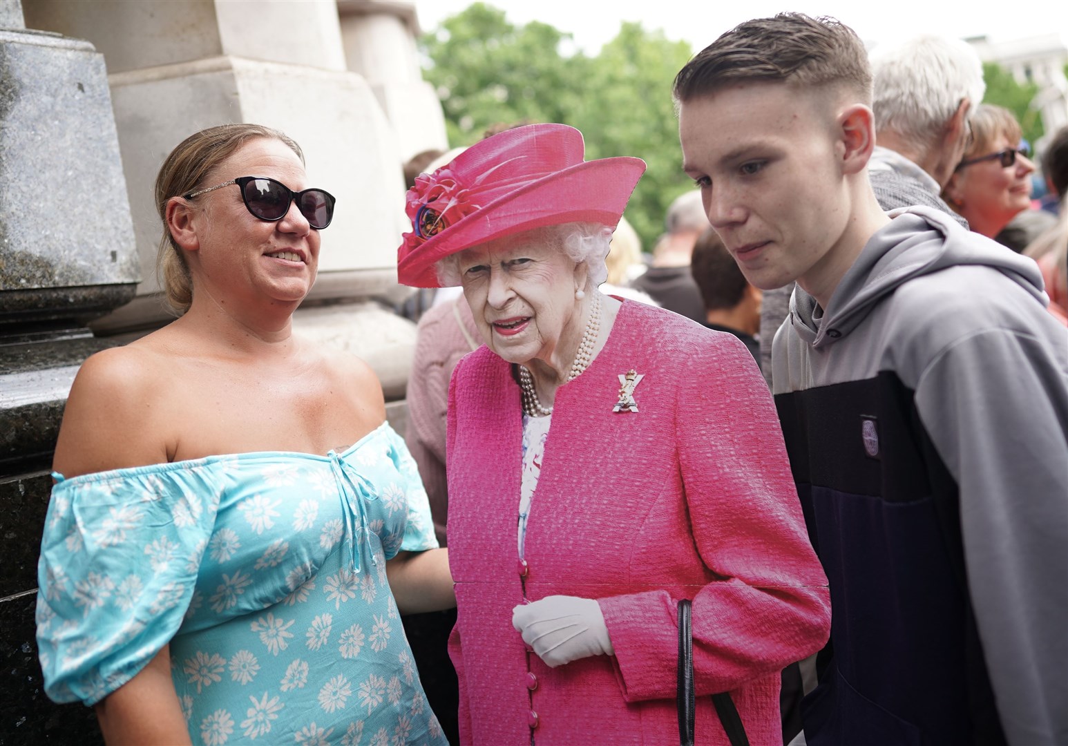 While the Queen had opted to stay in Windsor, fans outside the cathedral brought along a cardboard cut-out (Kirsty O’Connor/PA)