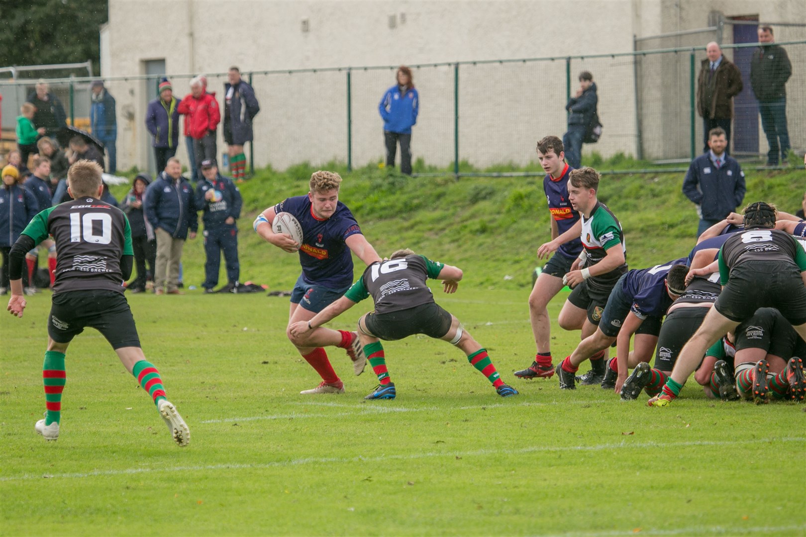 Tom Bannerman holds off a Highland 2nds tackle as Ross Sutherland try to move the ball quickly from a scrum. Picture: Peter Carson
