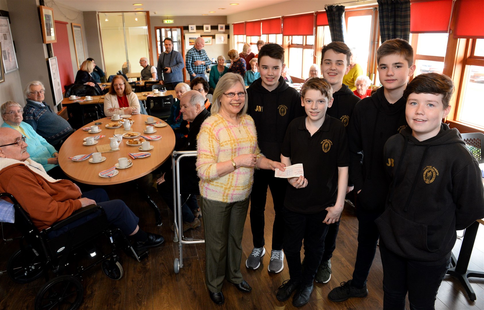June Dingley, vice-chairman of Seaboard Cares, receives a £3000 cheque from Youth Philanthropy Initiative pupils of Tain Royal Academy. They are (from left) Jamie Munro, Joe Gardener, Torran McCann, Noah Walkington and Johnie Beattie. Picture: Gary Anthony. Image No.043359.