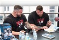 'Inspirational' strongman brothers greeted by queues of fans at first book signing