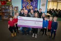 Alness Coulhill Primary pupils cheque out generous support from local business 