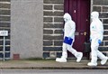 PICTURES: Detectives comb area after woman's body found in Highland town