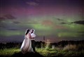 Newly weds illuminated in spectacular Highland Northern Lights picture 