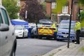 Man shot dead by armed police after chase ends in residential street