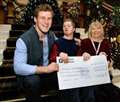 Fort Augustus rowing ace presents Down's Syndrome charity cheque