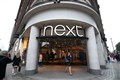 Next raises profit outlook after sales boost, but remains wary over Christmas