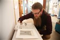 Page from 800-year-old bible on display at Glastonbury Abbey