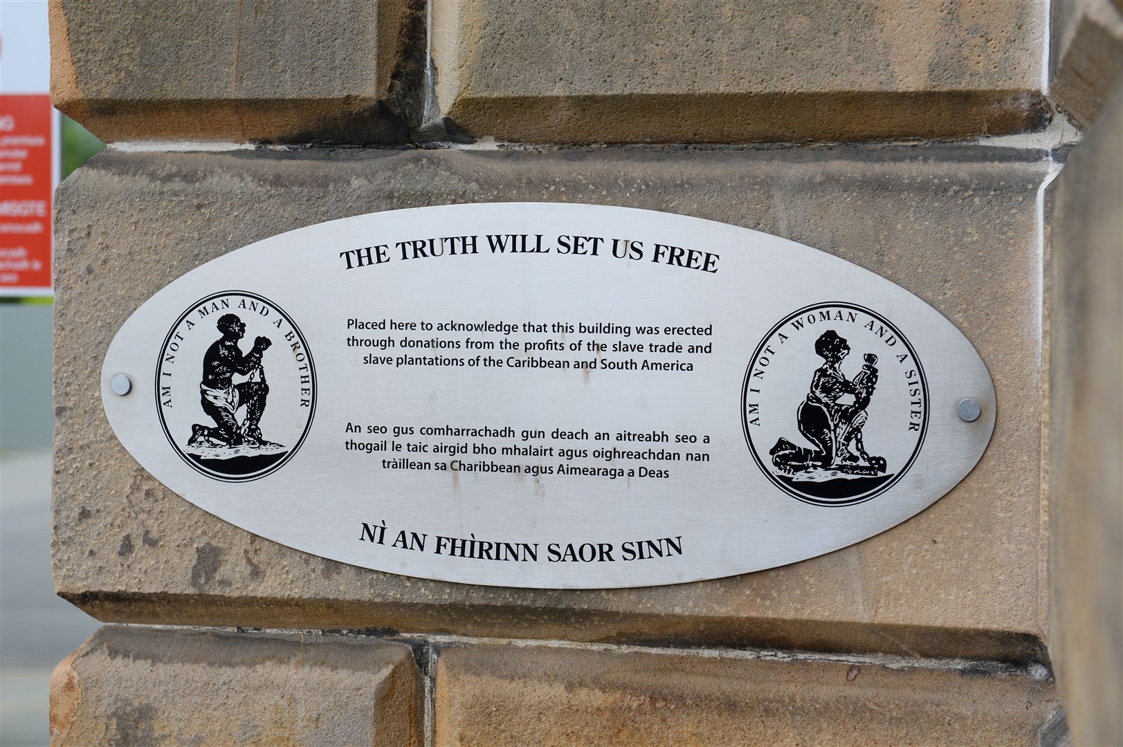 A plaque at UHI headquarters makes the building's links to slavery clear.