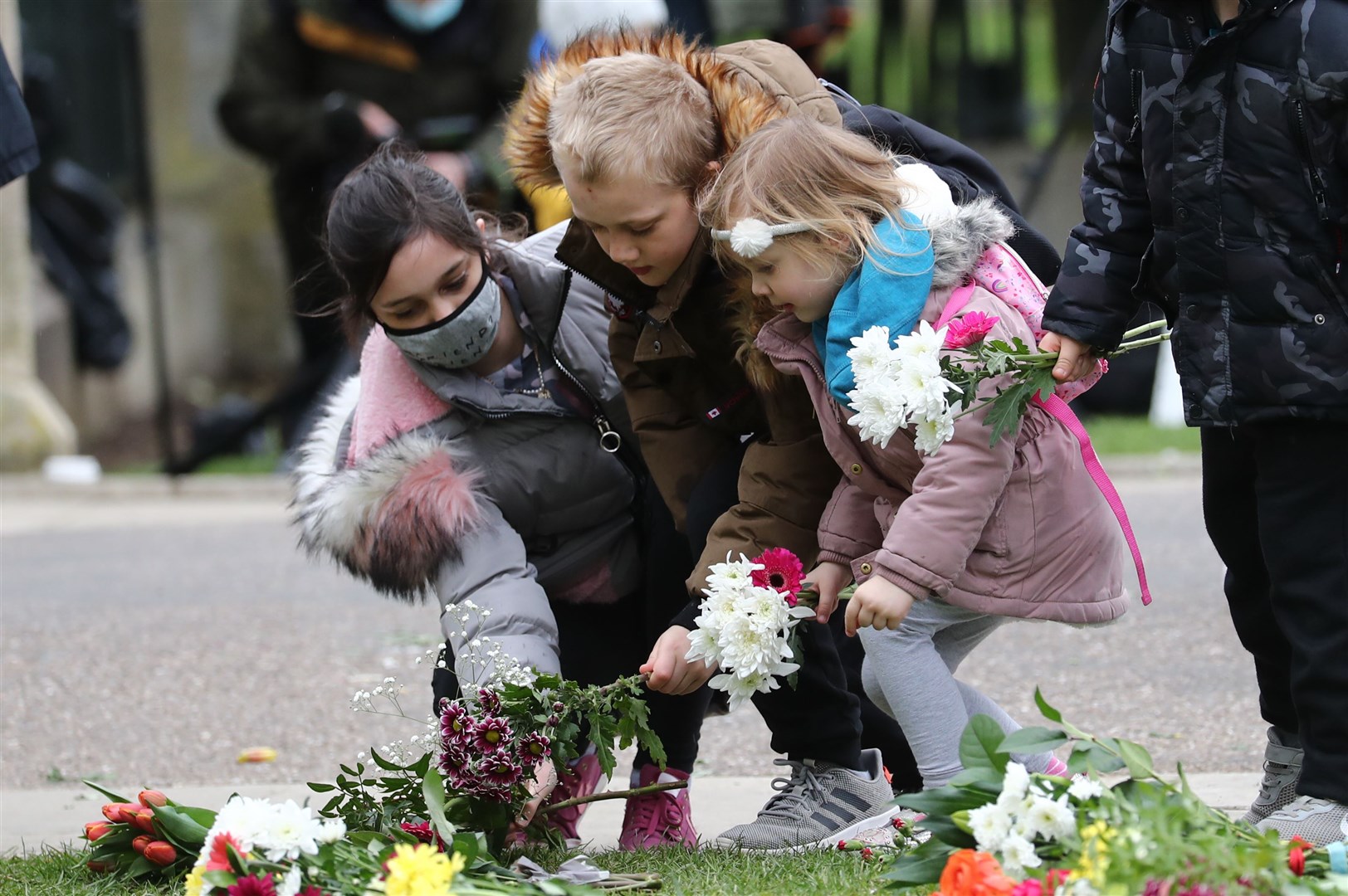 A family added their tributes in Windsor (Gareth Fuller/PA)