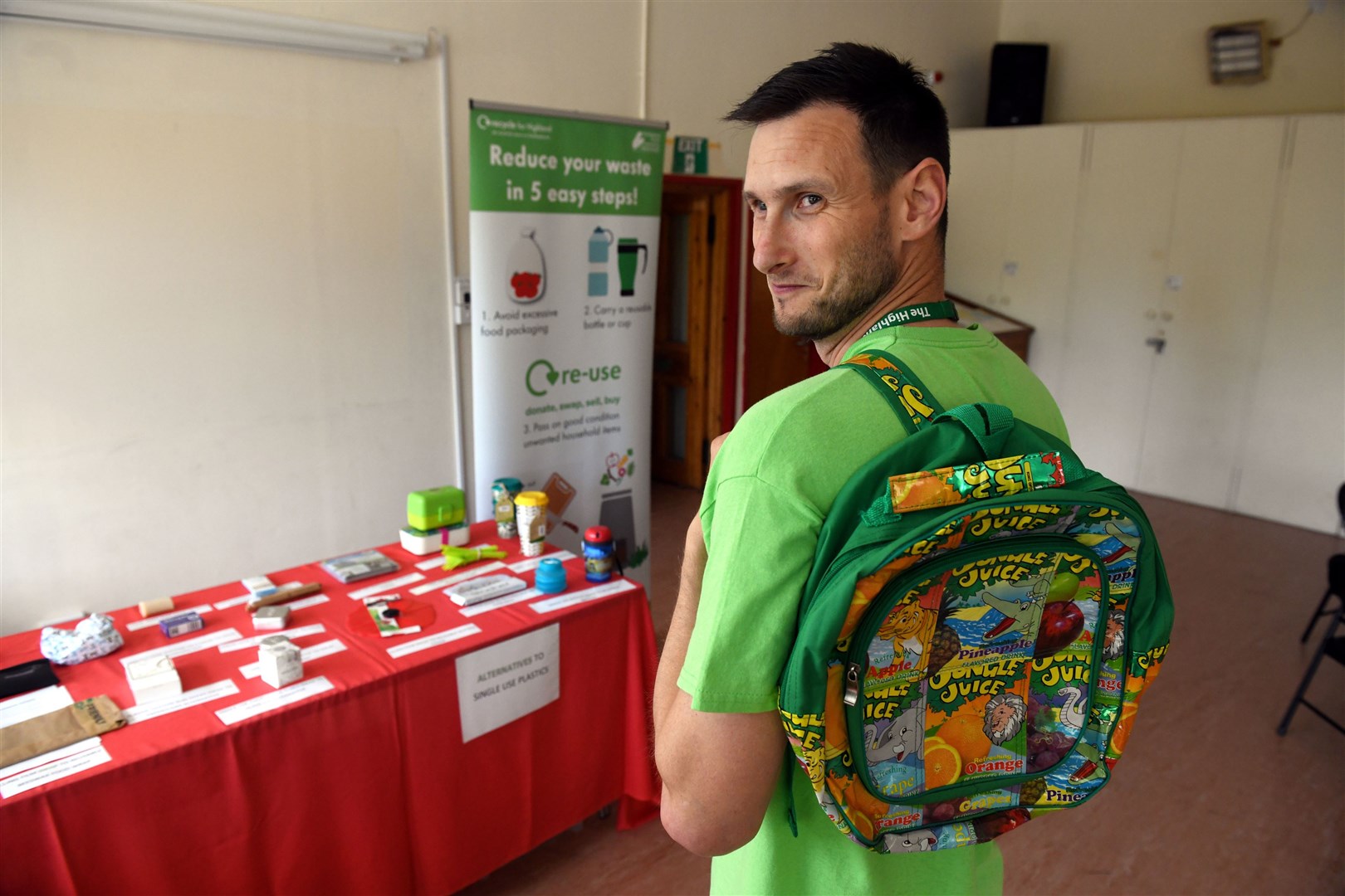 Mateusz Wolczyk, Waste Management Assistant showing off the bag made from recycled juice packets. Picture: James Mackenzie.