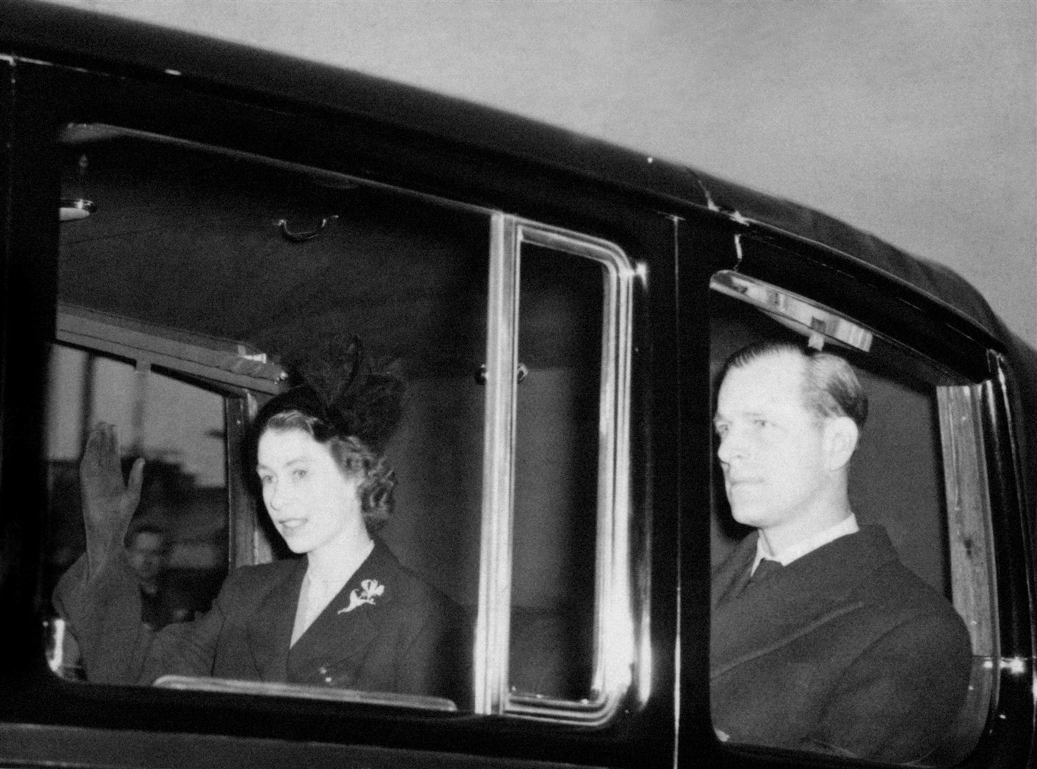 The new Queen, Elizabeth II returns to Clarence House, London, with the Duke of Edinburgh from London Airport after the sudden death of her father (PA)