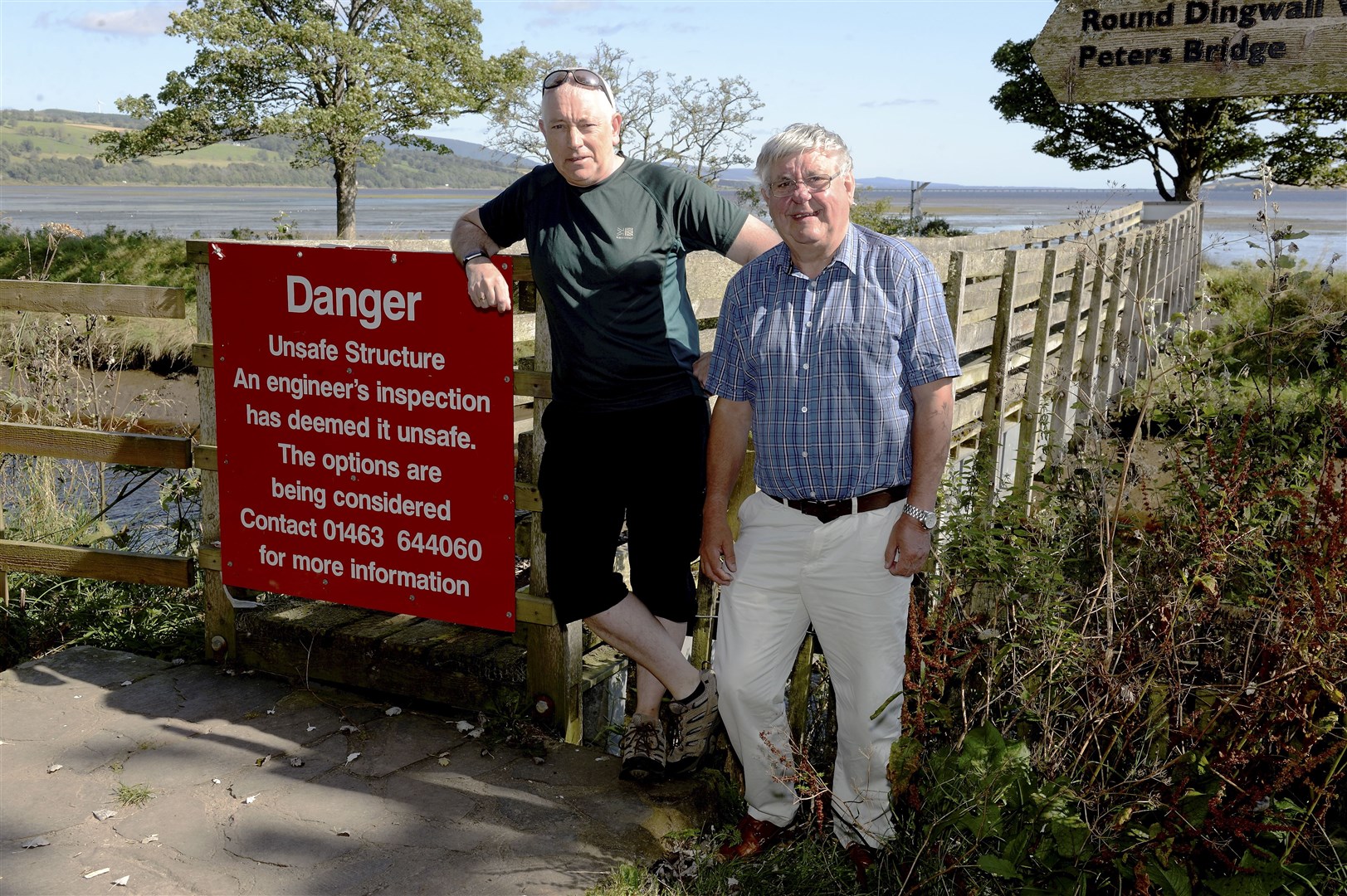 Dingwall Community Council chairman Jack Shepherd and local Highland councillor Graham Mackenzie at the canal footbridge which is now to be replaced. Picture: James Mackenzie.