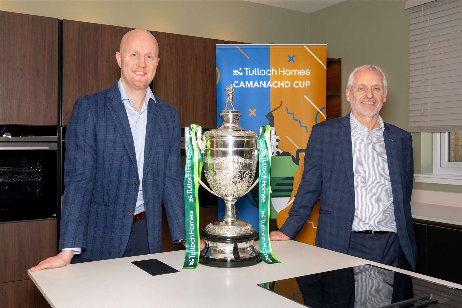 Kieran Graham, Tulloch Commercial Director and Sandy Grant, Tulloch Homes Managing Director with the Tulloch Homes Camanachd Cup.