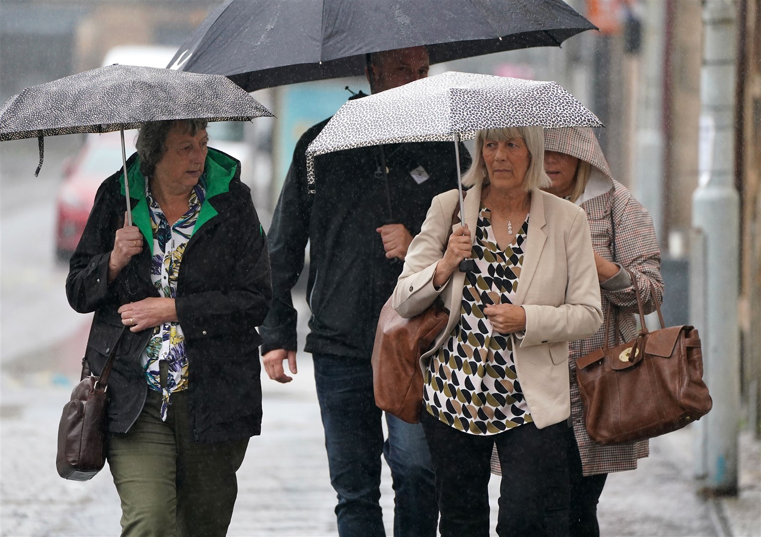Jane Midgley, right, the mother of victim Simon Midgley arriving at Paisley Sheriff Court for the Fatal Accident Inquiry (Andrew Milligan/PA)
