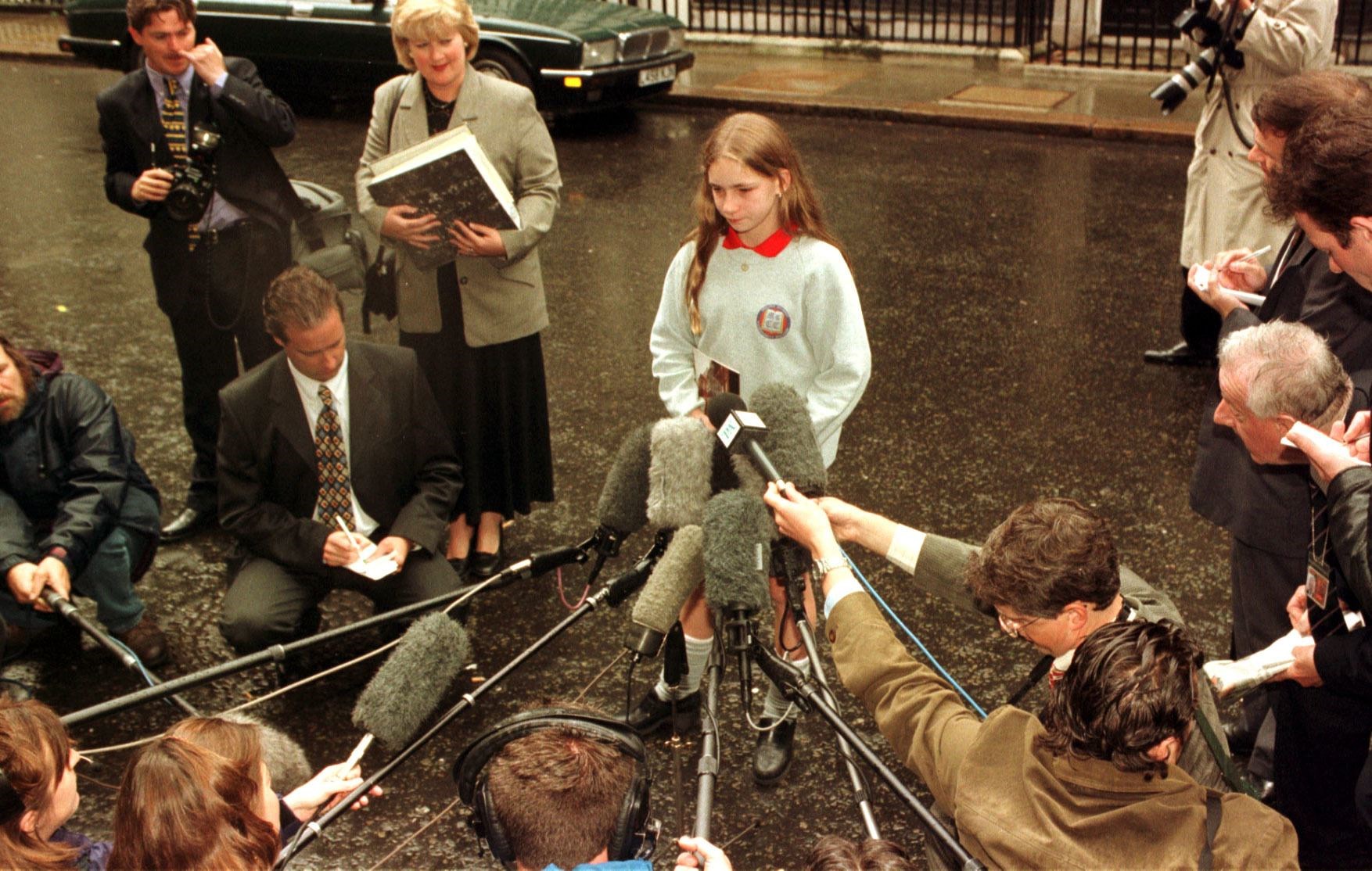 Belfast schoolgirl Margaret Gibney being interviewed by the press after meeting Tony Blair in Downing Street in 1997 (Peter Jordan/PA)