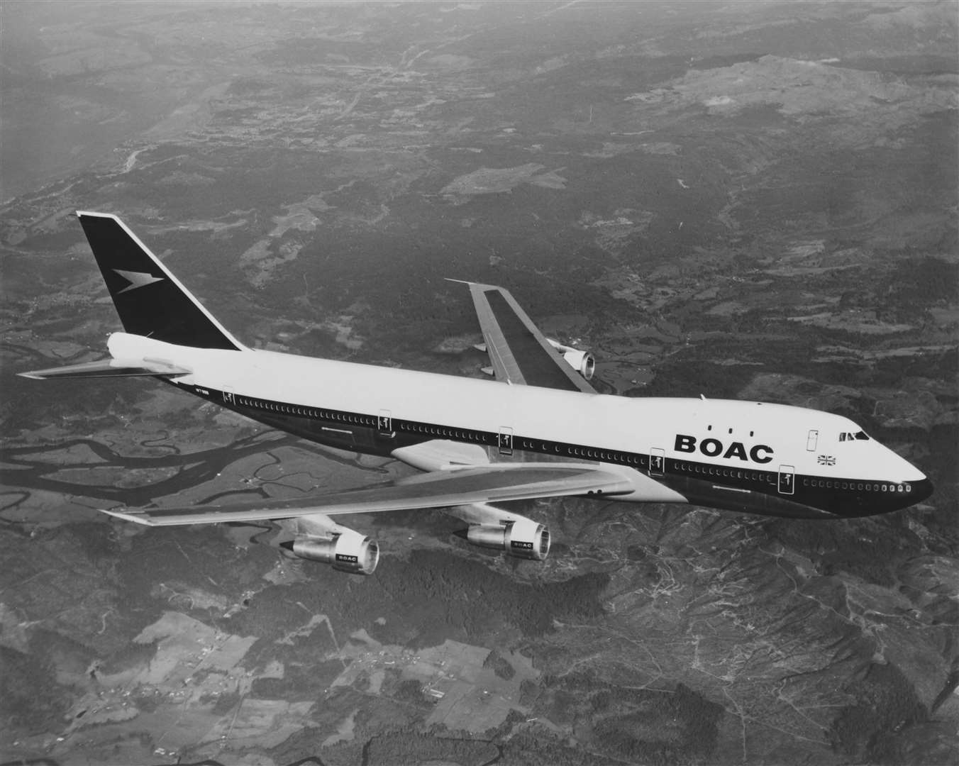 British Overseas Airways Corporation Boeing 747 flying above the UK in the 70s (British Airways/PA)