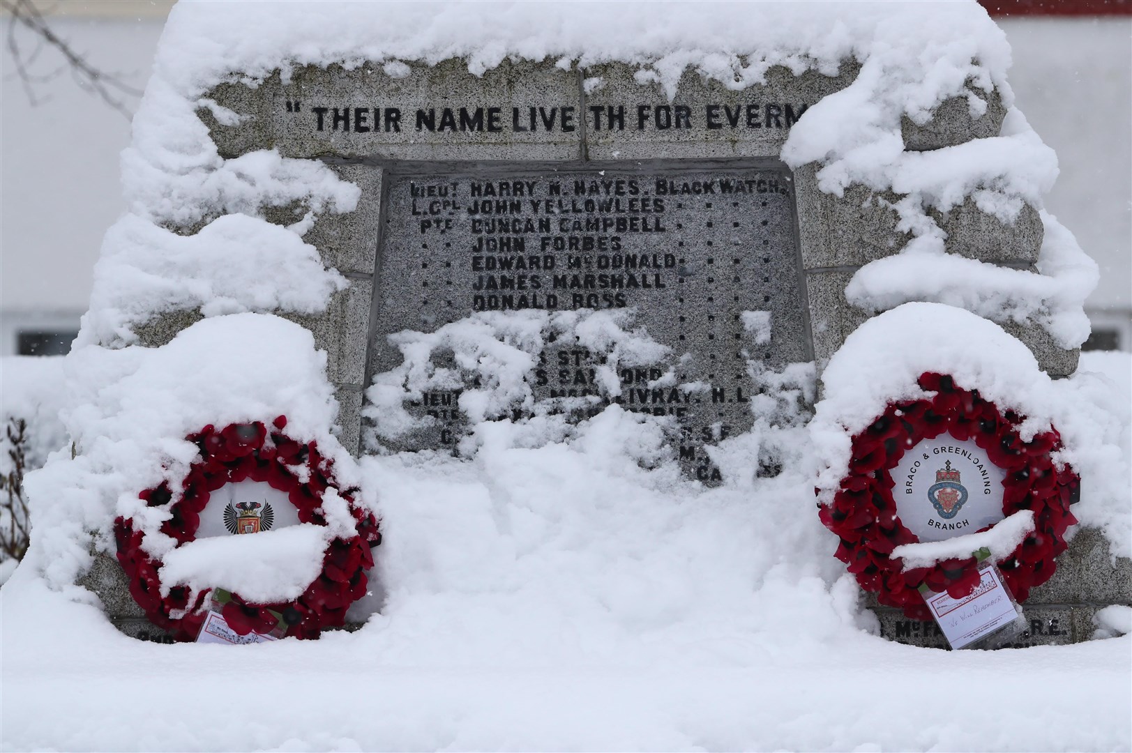 A war memorial covered in snow in Braco, near Dunblane in Scotland (Andrew Milligan/PA)