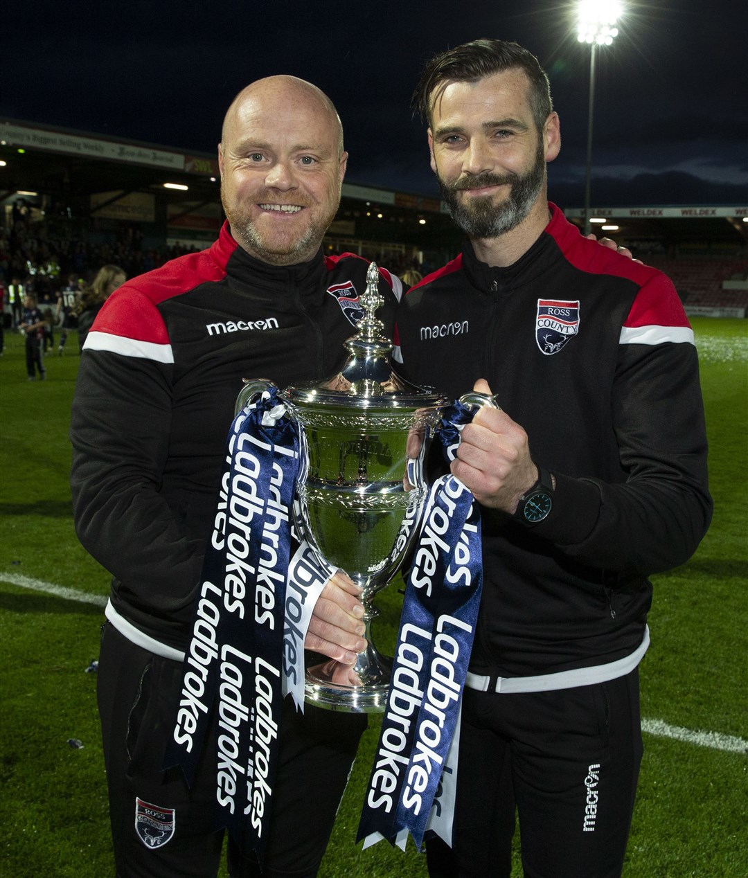 Ross County co-managers Steve Ferguson and Stuart Kettlewell celebrate with the Championship Trophy.
