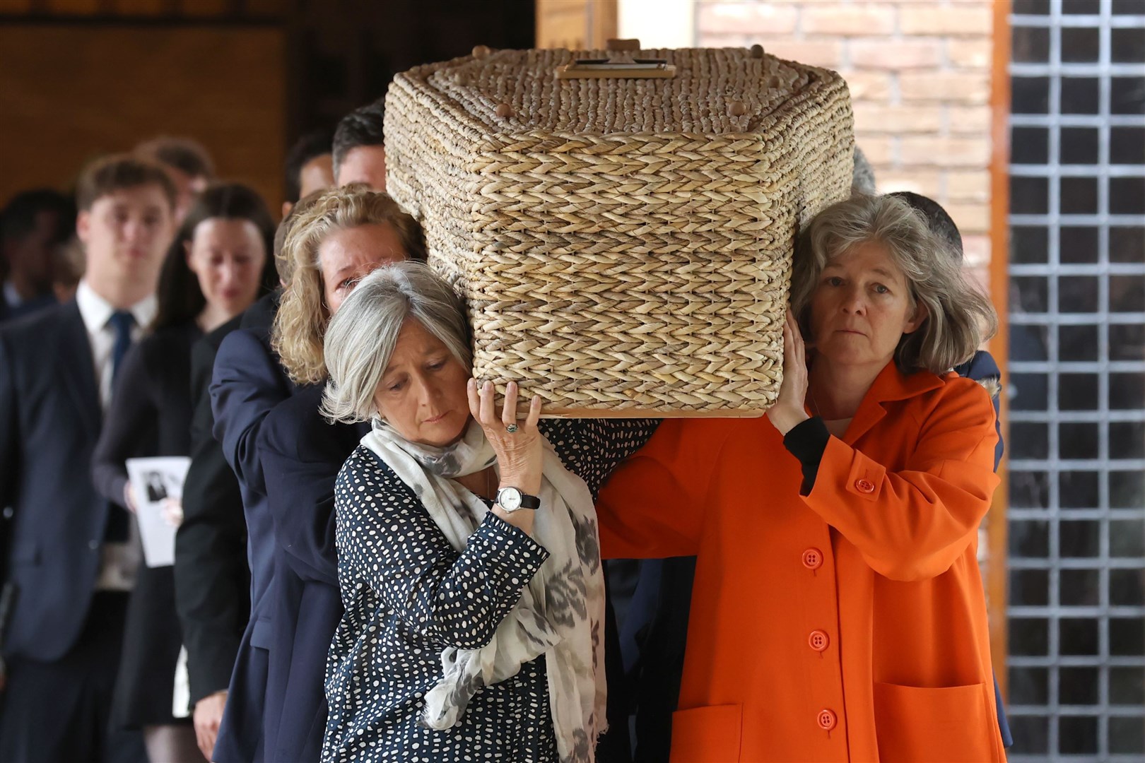 The coffin of Jim Fitzpatrick is carried from St Brigid’s Church (Liam McBurney/PA)