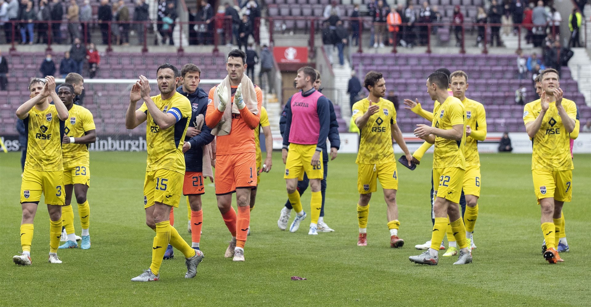 Ross County captain Keith Watson leads his team’s support for their large travelling support at the end.