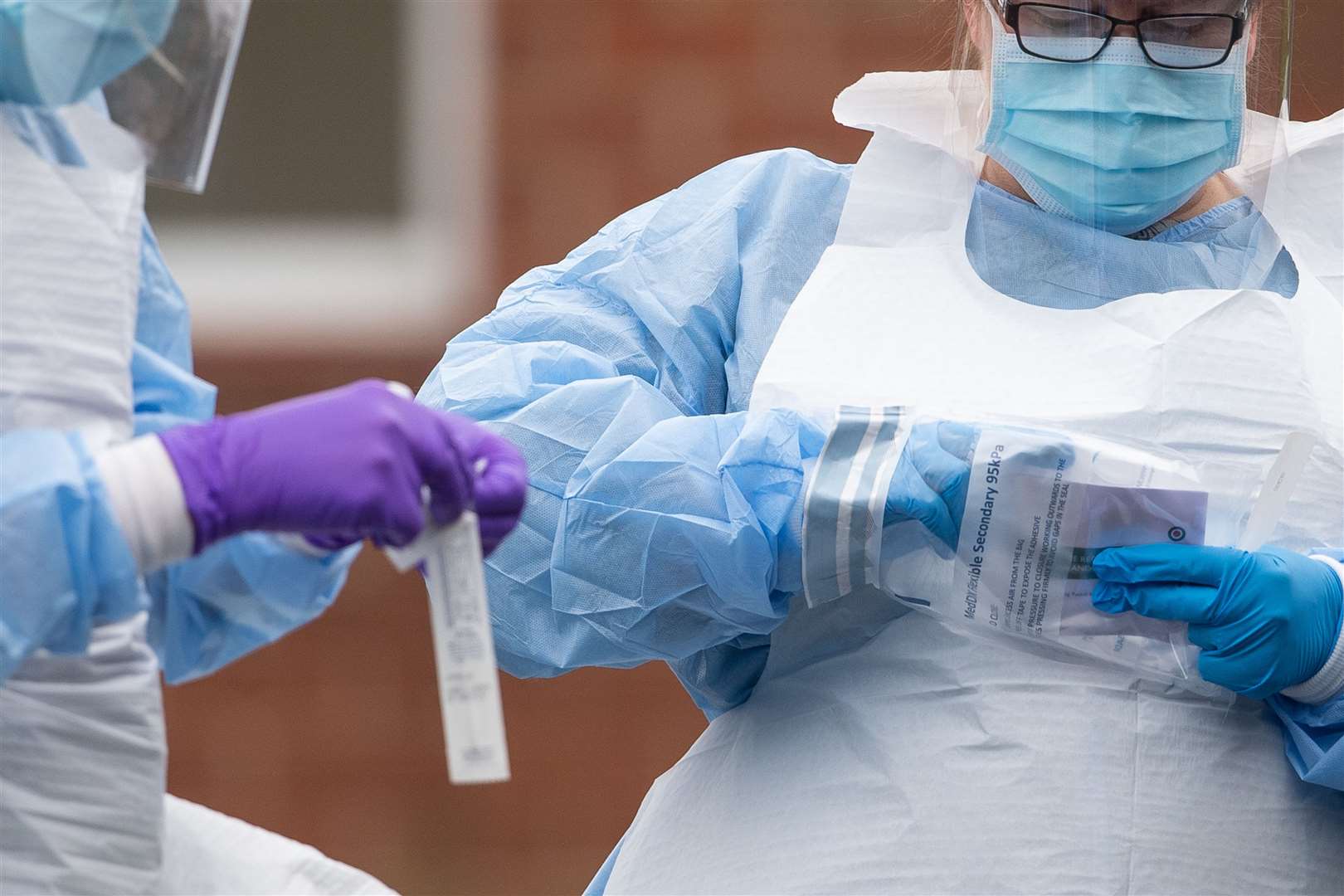 NHS staff carry out coronavirus tests at a facility in Bracebridge Heath, Lincoln (Joe Giddens/PA)