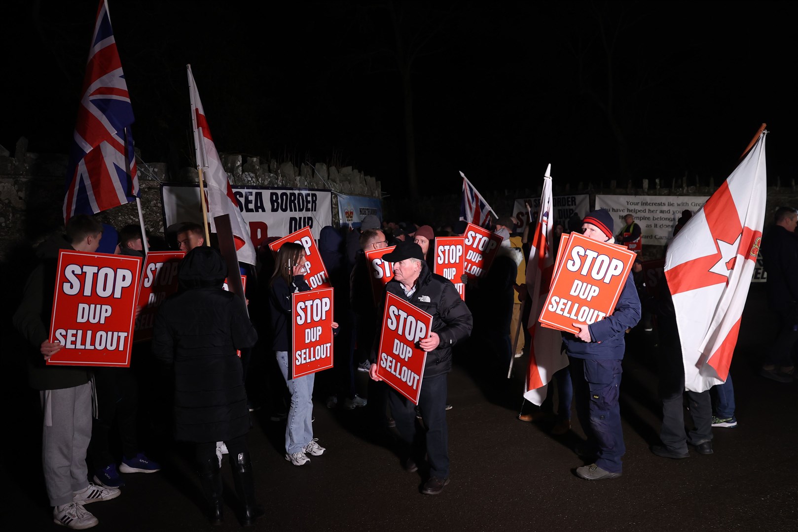 Protesters outside Larchfield Estate where the DUP held its executive meeting on Monday night (Liam McBurney/PA)