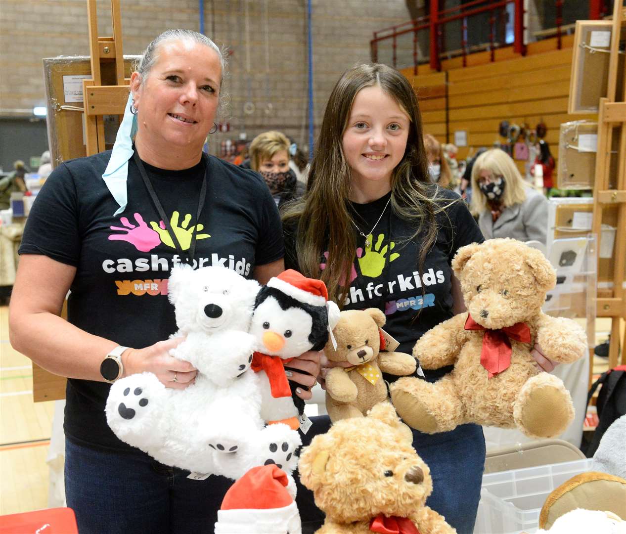 Giant Christmas Fayre at Inverness Leisure Centre. Cash for kids tombola stall volunteers Fiona and Eilidh Will.Picture Gary Anthony.