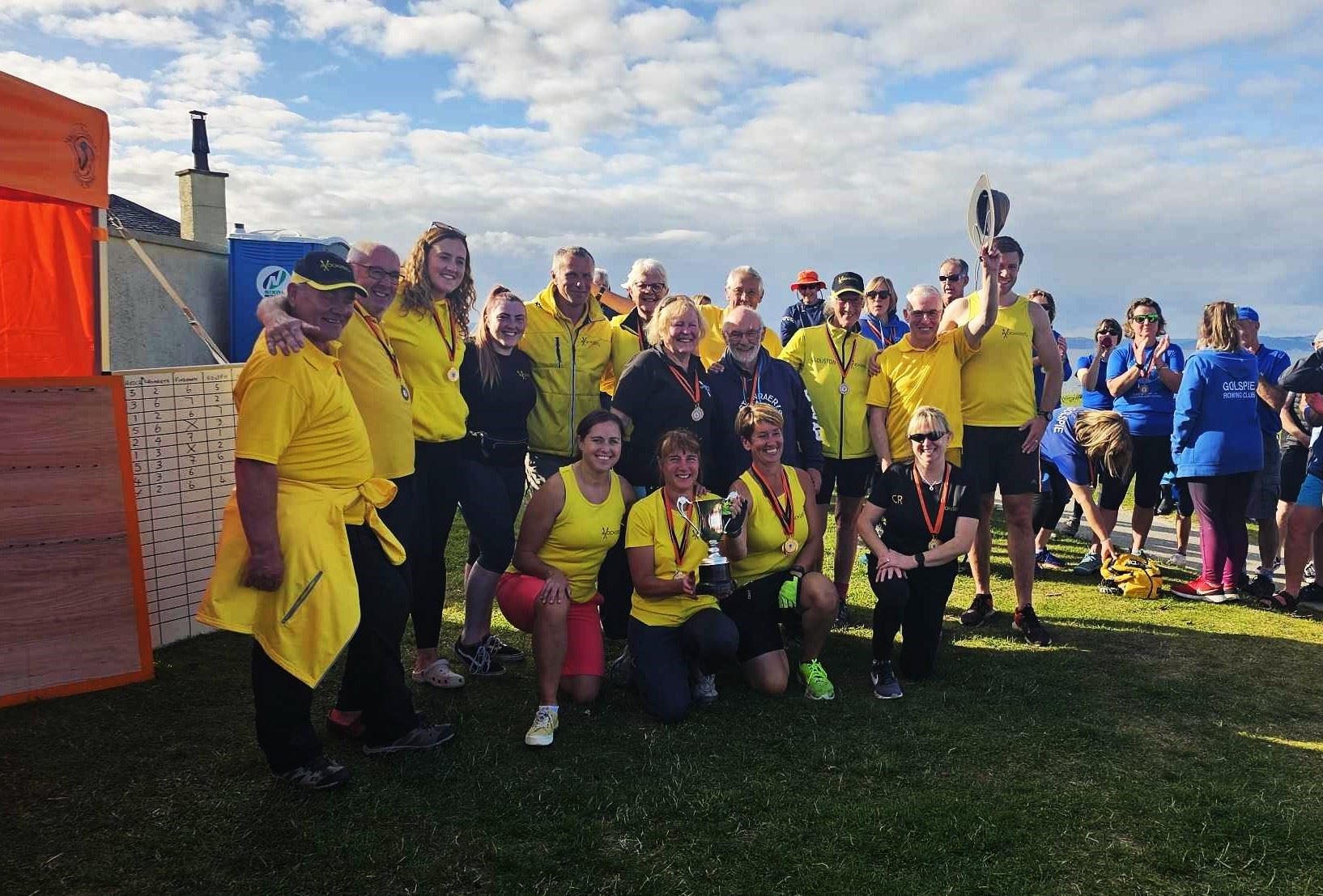 The Avoch Rowing Club team was presented with the Strathnairn cup after winning the first Nairn Regatta.