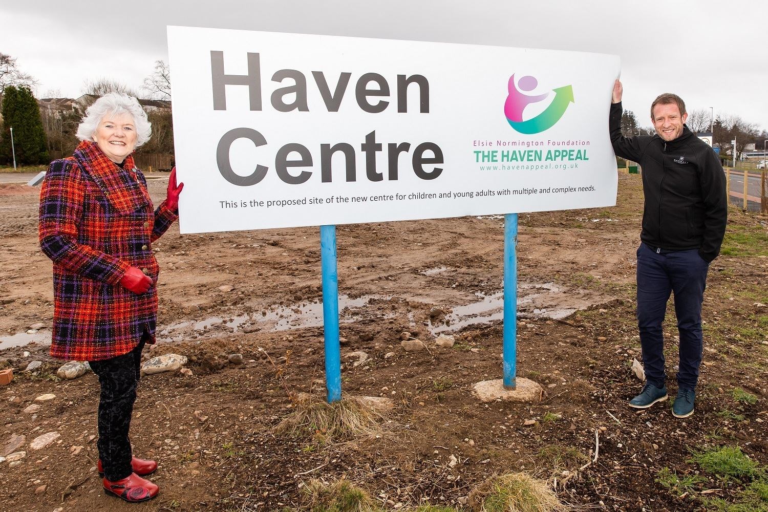 Elsie Normington with Alan Fraser, construction manager for Barratt Homes, at the site of the planned Haven Centre.
