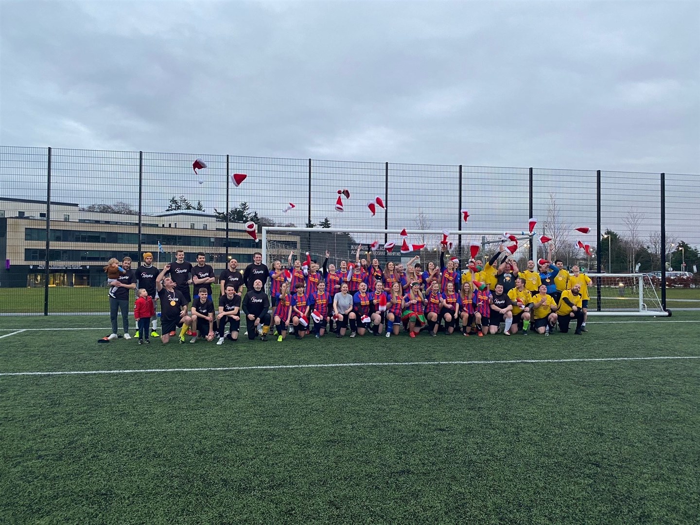 Players take part in a football tournament in tribute to Carolyn Firth.