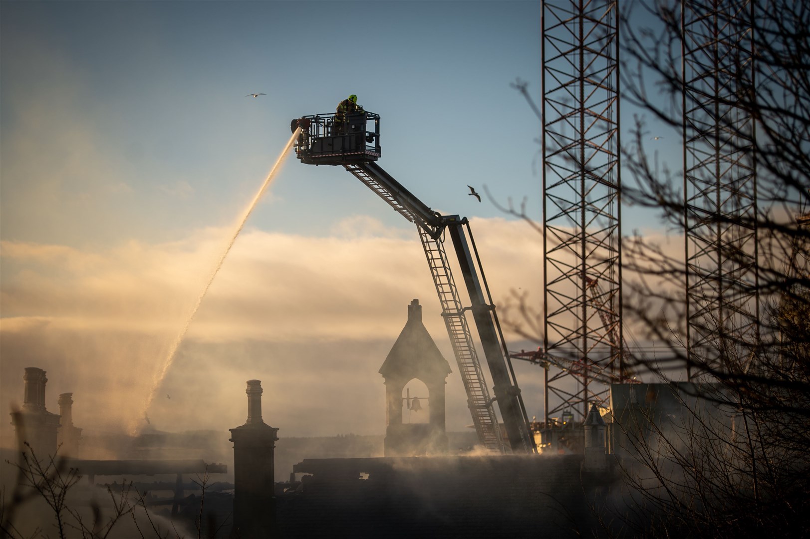 Firefighters pictured tackling the second fire. It happened almost exactly a year ago to the day after the first, which devastated the school on February 24 last year. Picture: Callum Mackay.