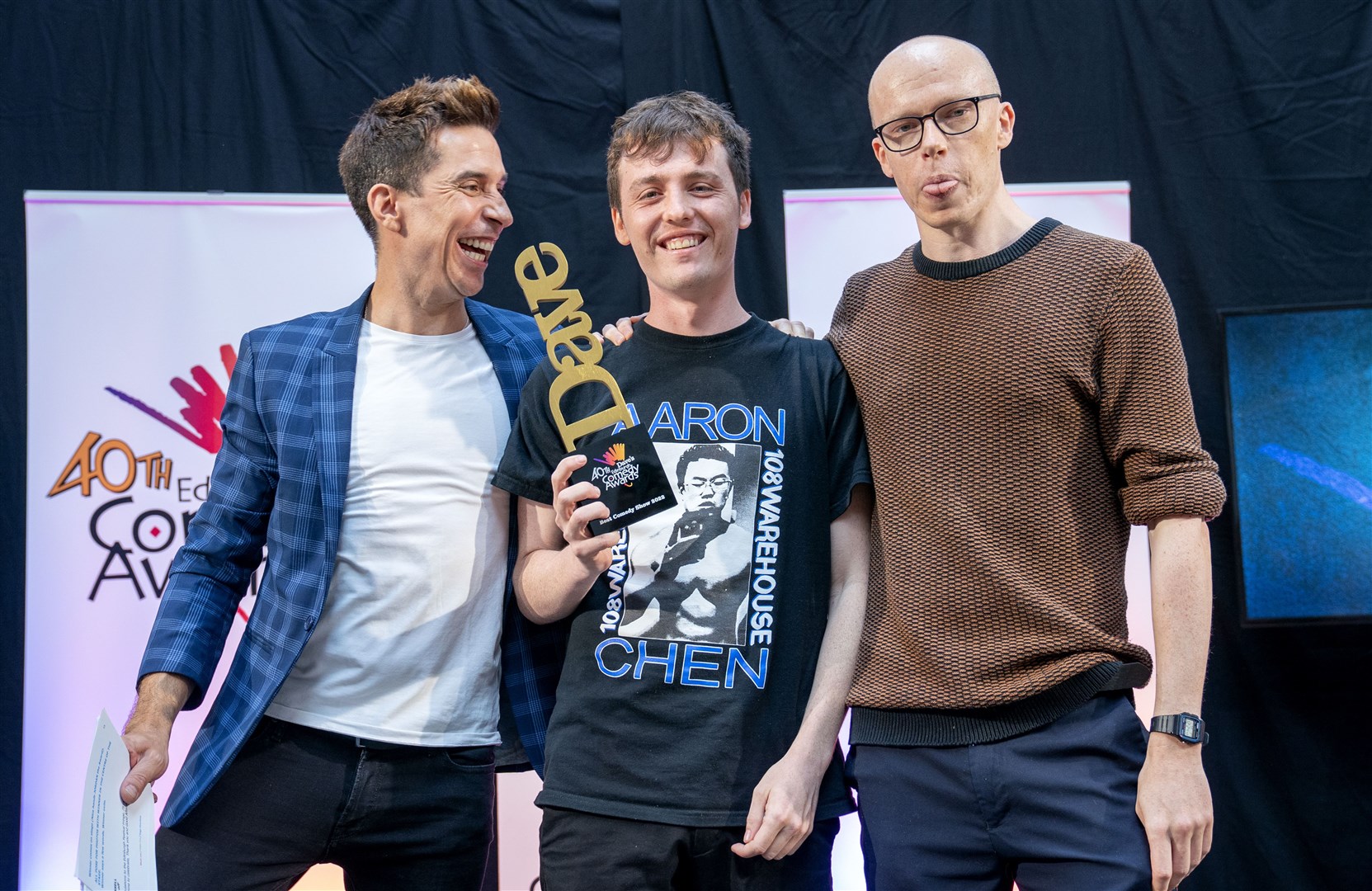 Sam Campbell was presented with his award by Russell Kane and Jordan Brookes (Jane Barlow/PA)