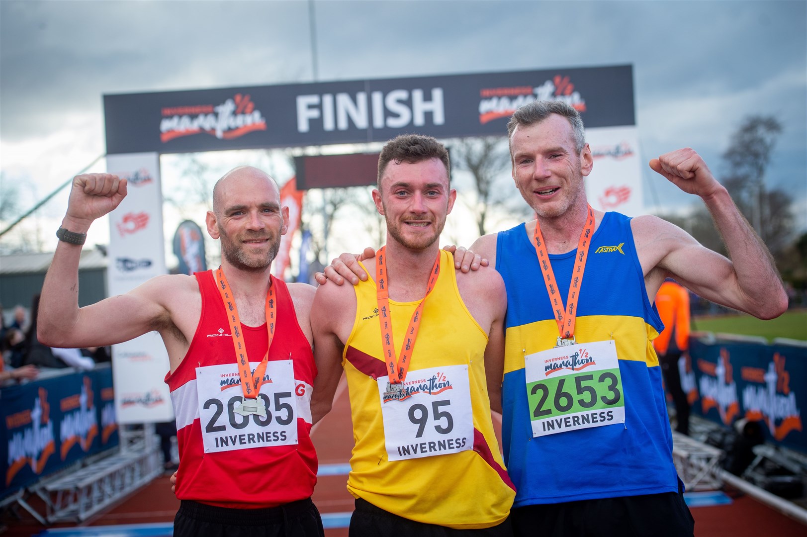 Sean Chalmers (centre) pictured with Fraser Stewart and Peter Avent after winning the Inverness Half Marathon. Picture: Callum Mackay