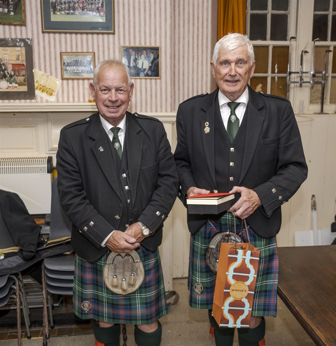 Piper Charlie Ross (right) presented with a quaich by Pipe Major Willie Fraser. Picture: Andy Kirby