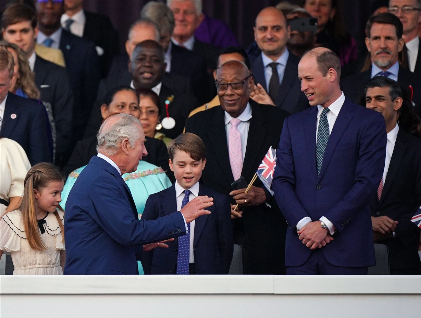 The King greets the Prince of Wales and Prince George (Yui Mok/PA)