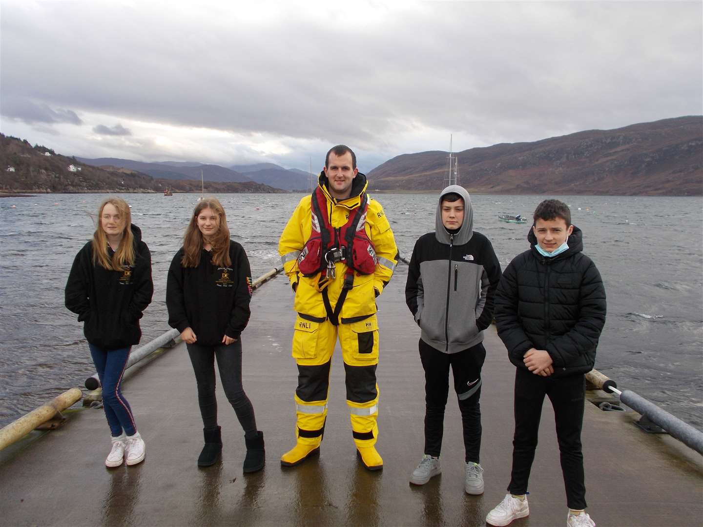 Millie, Poppy, Fionn and Lewin from the winning team, together with Joe Mackay fromthe Lochinver lifeboat crew and staff from Ullapool High School.