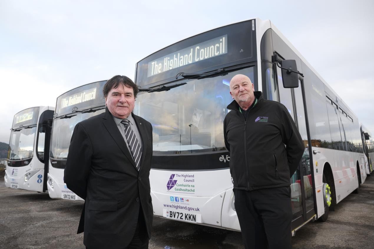 Pictured with some of the new buses ready to start the routes in January is the Chair of the Economy and Infrastructure Committee, Cllr Ken Gowans and Project Manager Ali MacDonald