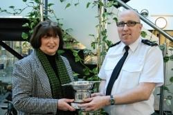 Gary receiving the Ewan Macrae Memorial Trophy from from the late Northern Constabulary Constable's mother Mary. PC Taylor starts a new role in Lochcarron this week.
