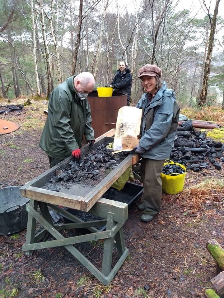 'Fiona (GALE Outdoor Learning Assistant) Aiden (Inverewe Gardens) and Johnathon (GALE supported volunteer) working hard bagging up the BBQ charcoal straight from the kiln!