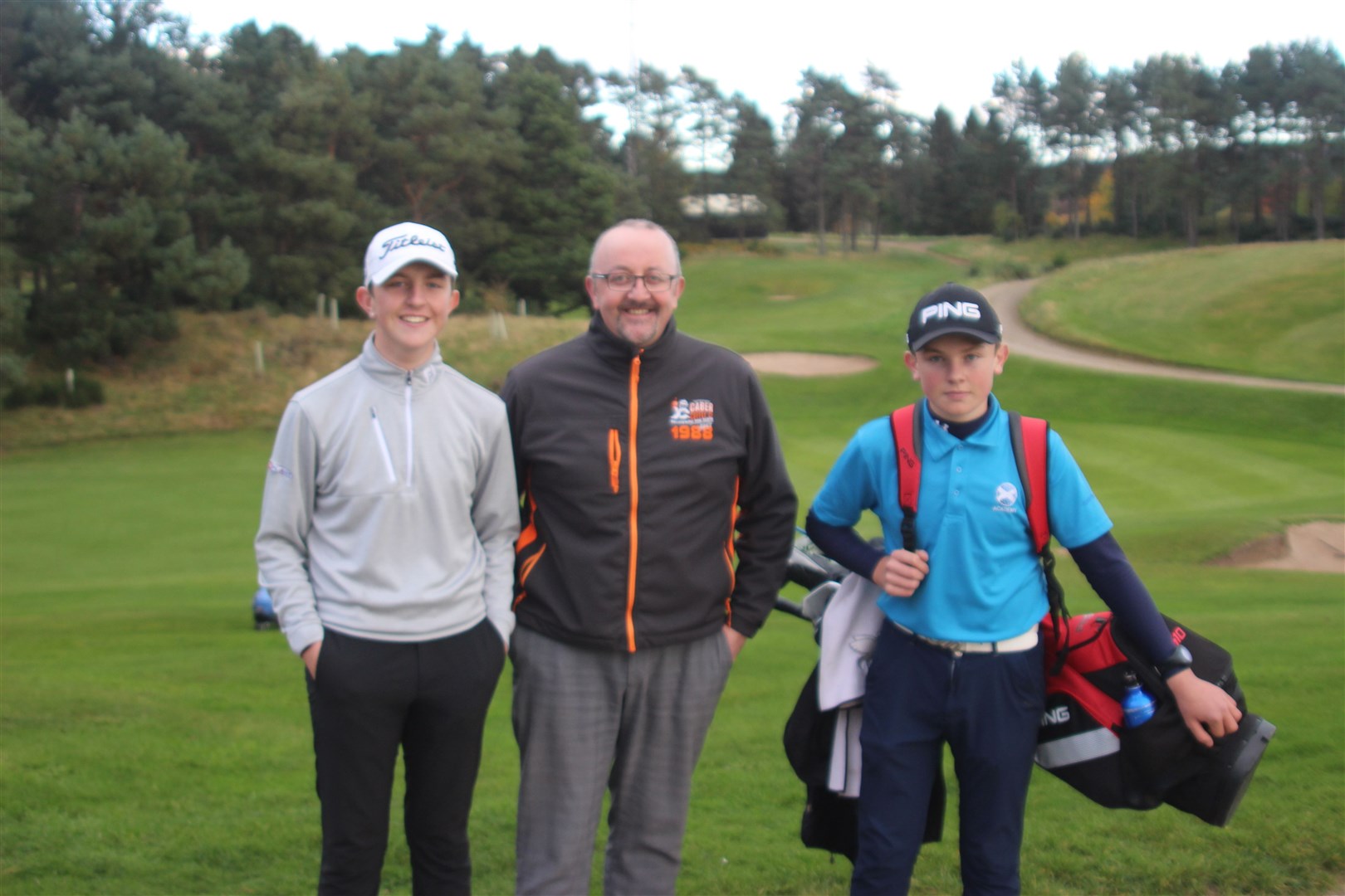 The winning Spark family leaving the Forres golf course. Left to right, Jack Spark, William (father) and under-15 champion Scott.